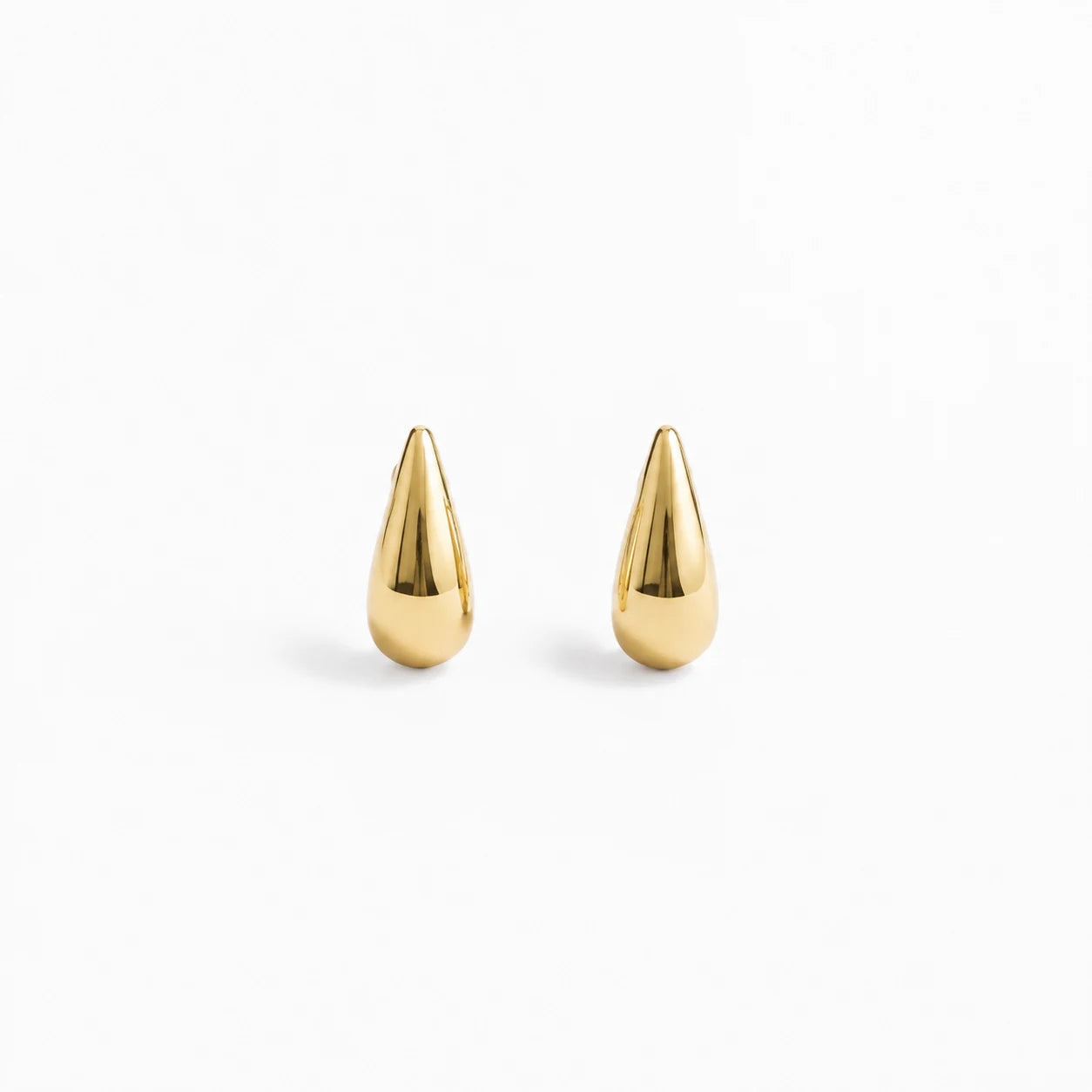 A pair of gold teardrop-shaped stud earrings with a polished metallic finish, displayed on a clean white background.