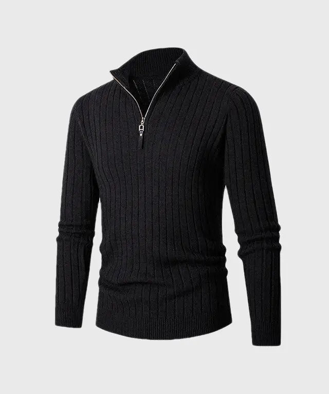 Black ribbed sweater with a zipper on a light gray background