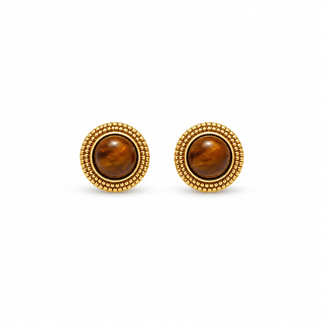 A pair of round stud earrings with polished brown tiger's eye stones and textured gold beaded borders, set against a plain white background.