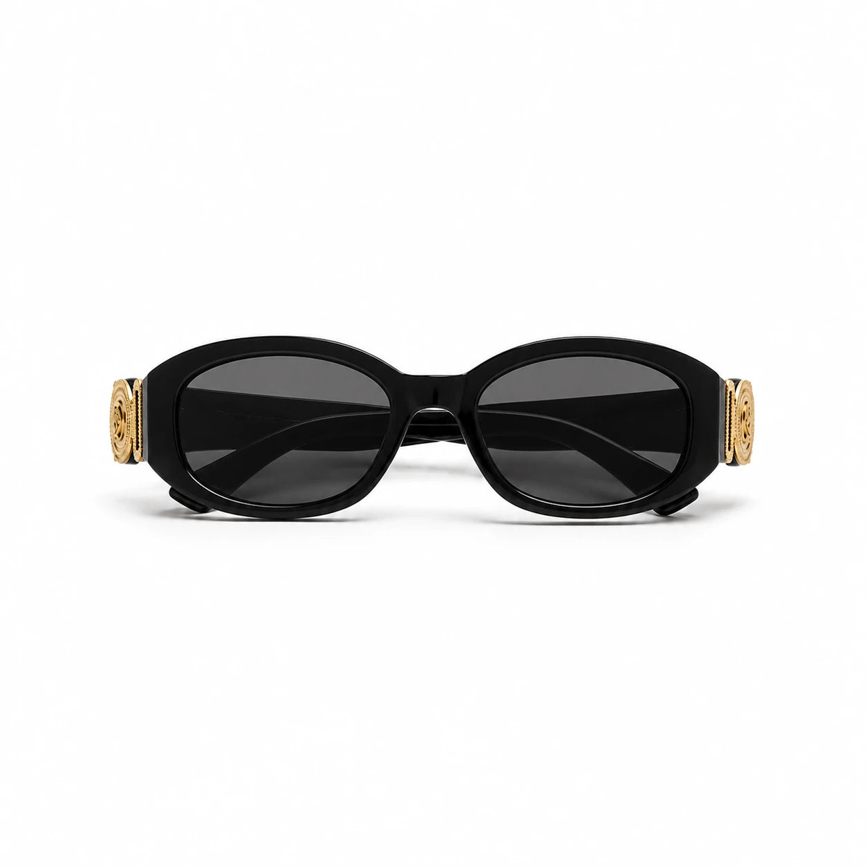 Oval sunglasses with a glossy black frame, dark lenses, and ornate gold decorative accents on the temples, shown against a plain white background.