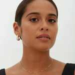 Alba earrings shown in a lifestyle setting, alternate view