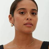 Alba earrings shown in a lifestyle setting, alternate view
