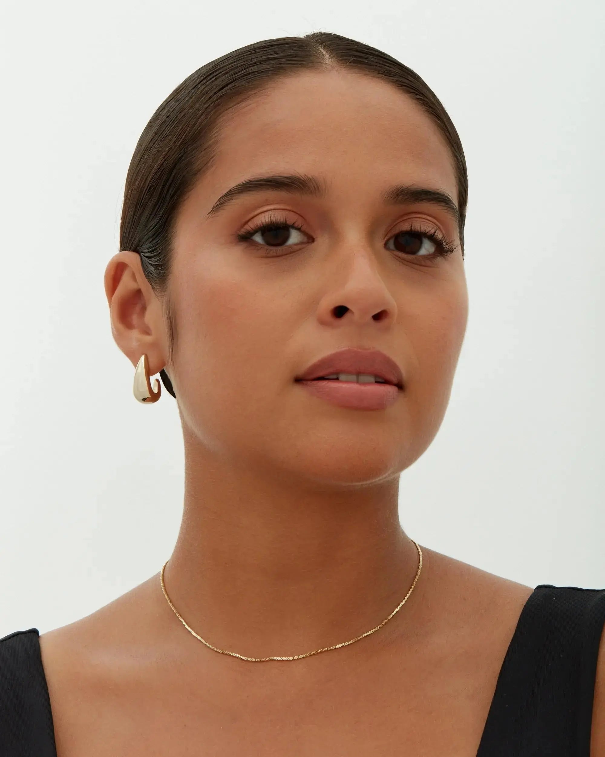 Alba earrings shown in a lifestyle setting, alternate view
