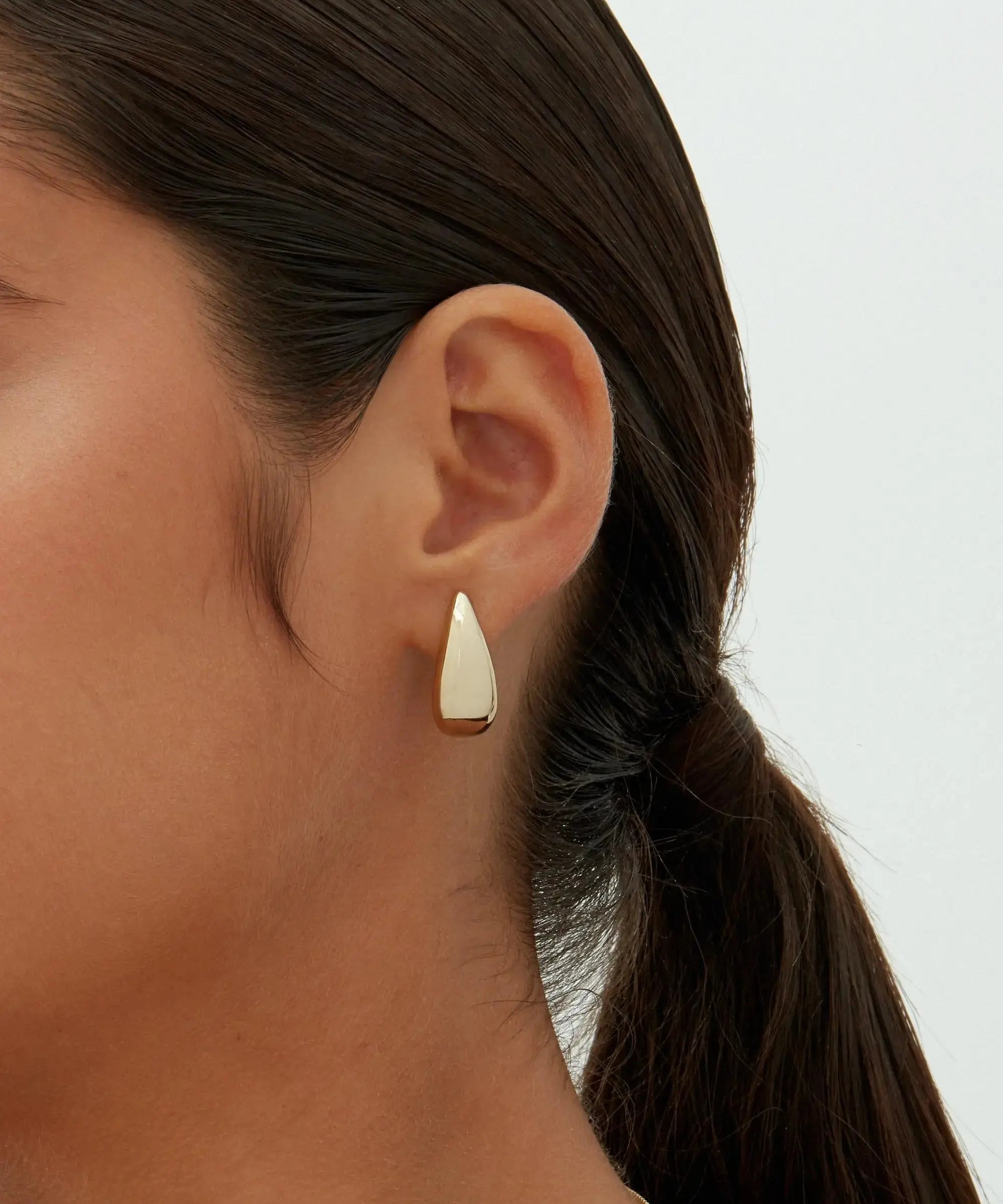 Alba earrings shown in a lifestyle setting