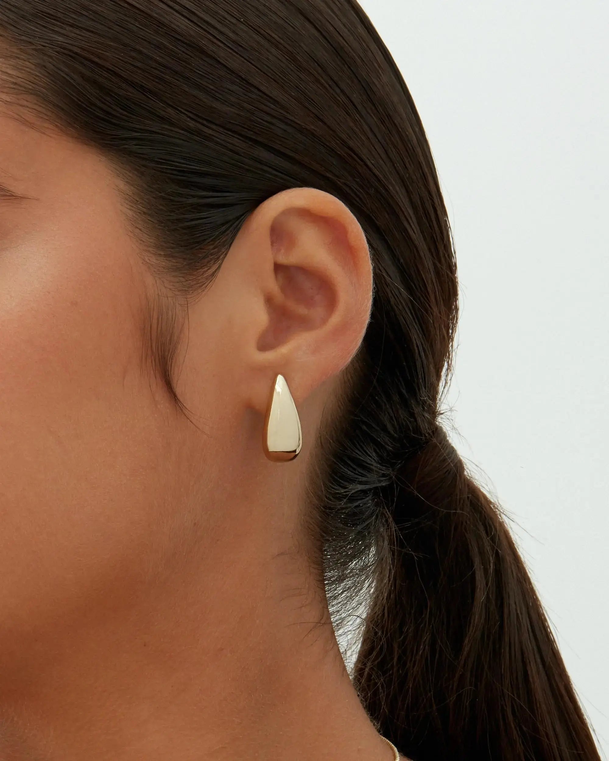 Alba earrings shown in a lifestyle setting