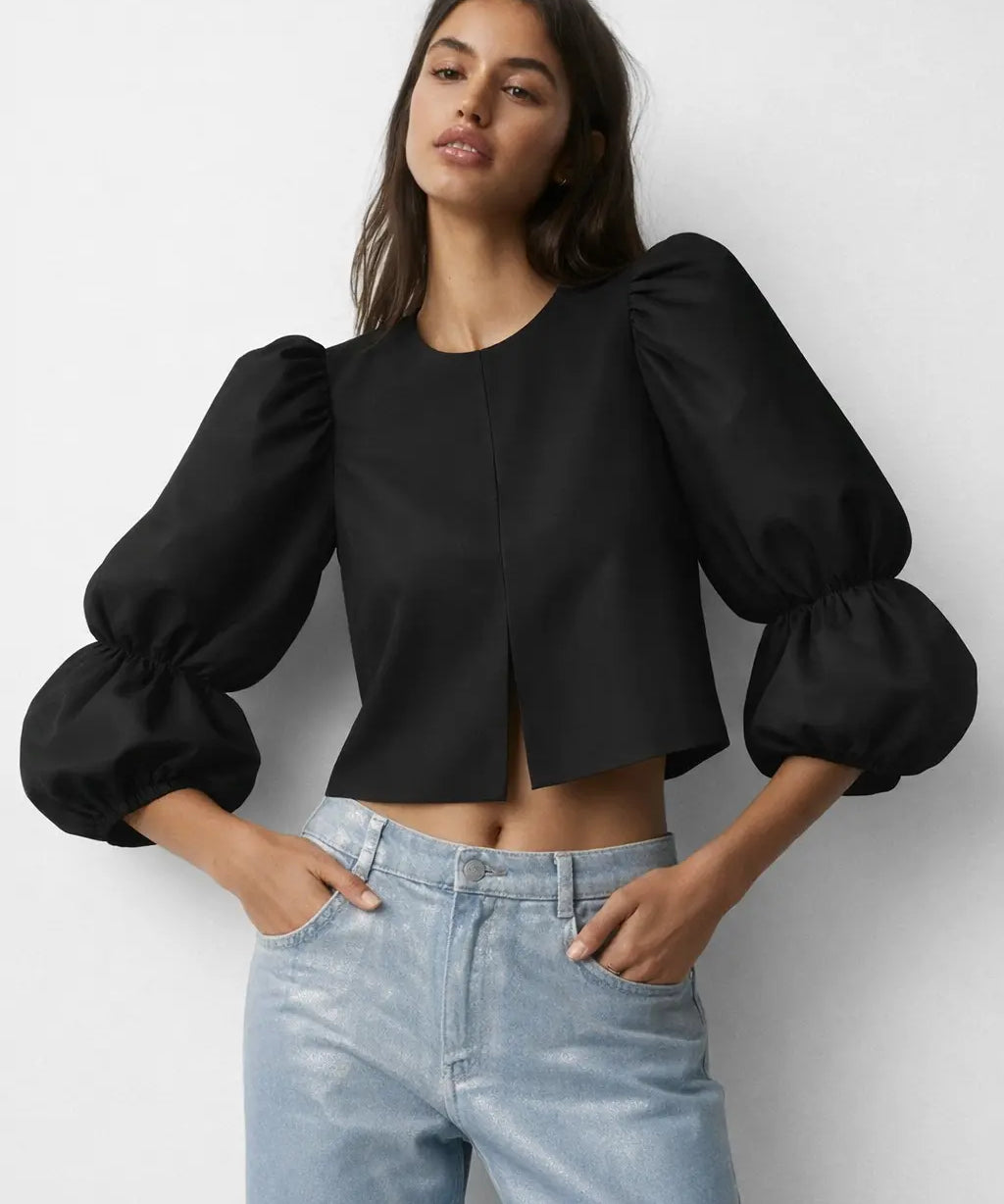 Balloon sleeve blouse shown in a lifestyle setting
