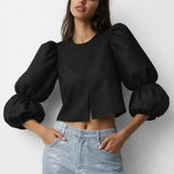 Balloon sleeve blouse shown in a lifestyle setting