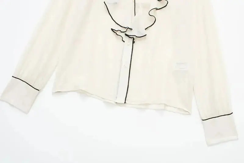 Close-up detail of Belle Blouse long sleeve, hardware detail