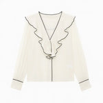 White Belle Blouse long sleeve shown in a lifestyle setting