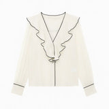 White Belle Blouse long sleeve shown in a lifestyle setting