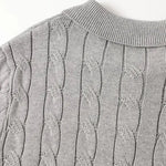 Close-up detail of BIELLA Cable Knit Polo, hardware detail