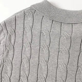 Close-up detail of BIELLA Cable Knit Polo, hardware detail