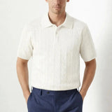 BIELLA Cable Knit Polo shown in a lifestyle setting, seated view