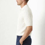BIELLA Cable Knit Polo shown in a lifestyle setting, walking view