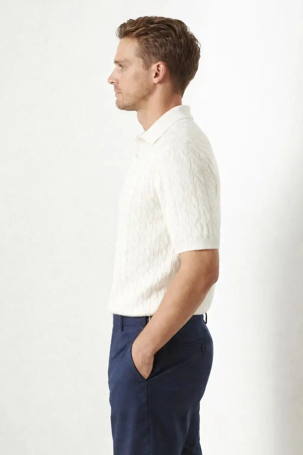 BIELLA Cable Knit Polo shown in a lifestyle setting, walking view