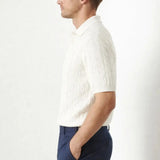 BIELLA Cable Knit Polo shown in a lifestyle setting, walking view