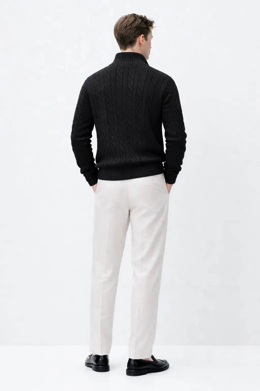 Cable Knit Half-Zip Sweater shown in a lifestyle setting, side angle view