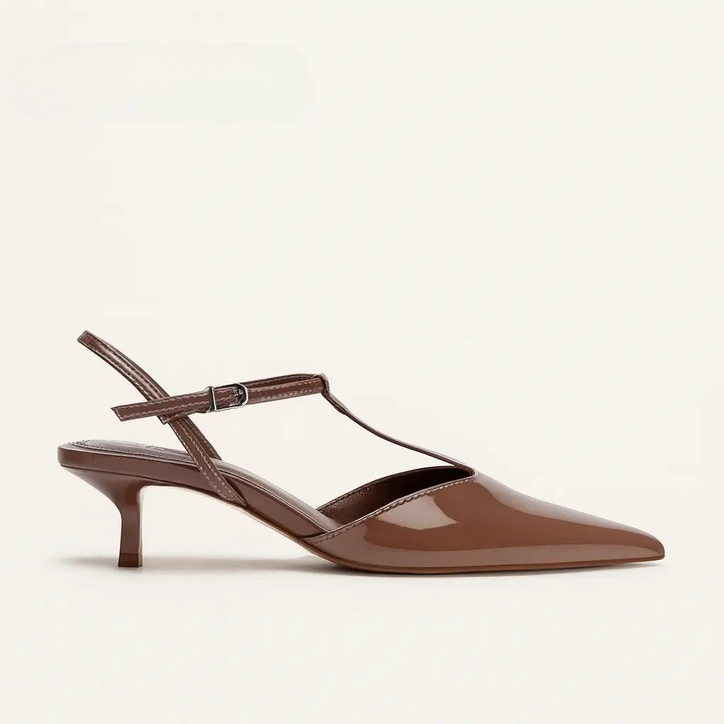 Three-quarter view of Brown Caressé Pumps