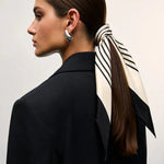 Cielé Scarf shown in a lifestyle setting, alternate view