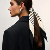 Cielé Scarf shown in a lifestyle setting, alternate view