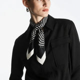 Cielé Scarf shown in a lifestyle setting, cropped view