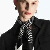 Cielé Scarf shown in a lifestyle setting, full length view