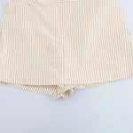 Coastal shorts shown in a lifestyle setting, cropped view