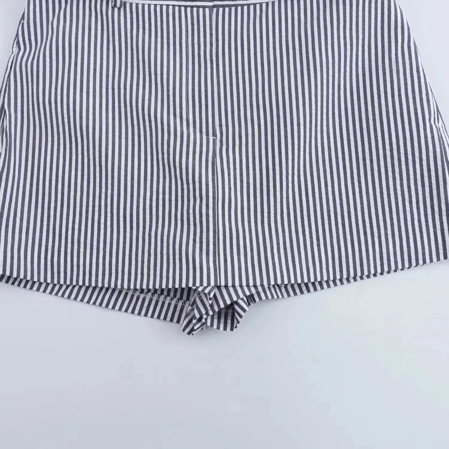 Coastal shorts shown in a lifestyle setting, full length view