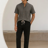 Dominica - Short-Sleeved Set shown in a lifestyle setting, full length view