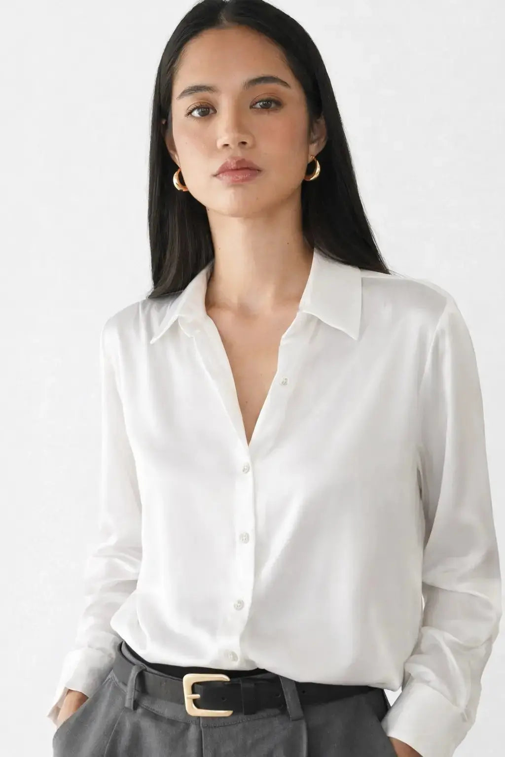Elegant Satin Blouse shown in a lifestyle setting, seated view