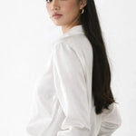Elegant Satin Blouse shown in a lifestyle setting, walking view
