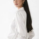 Elegant Satin Blouse shown in a lifestyle setting, walking view