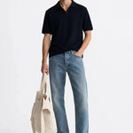 Fenice Polo-shirt shown in a lifestyle setting, cropped view