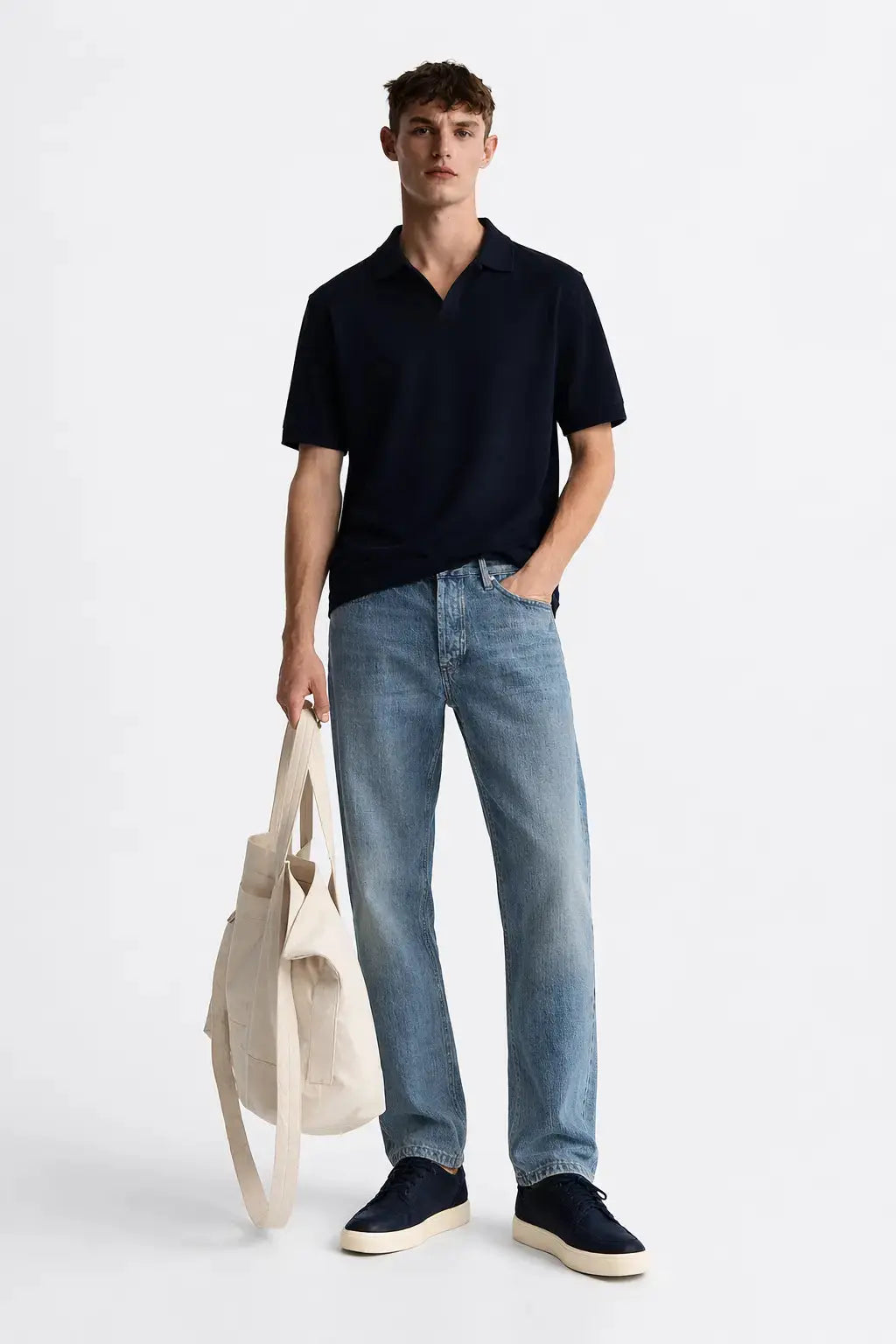 Fenice Polo-shirt shown in a lifestyle setting, cropped view