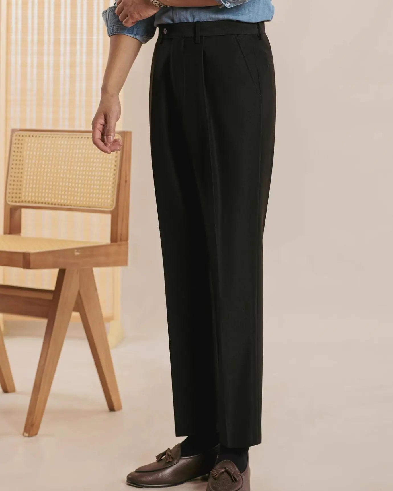 Fernache Italian Trousers shown in a lifestyle setting, cropped view