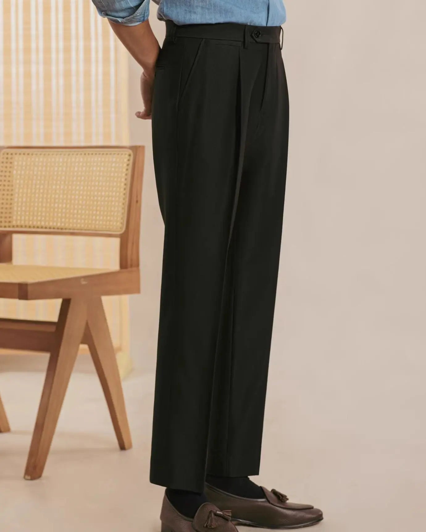 Fernache Italian Trousers shown in a lifestyle setting, side angle view