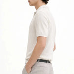 Fernache Polo Shirt shown in a lifestyle setting, alternate view