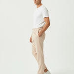 Fine Cotton Trousers Apricot shown in a lifestyle setting, full length view