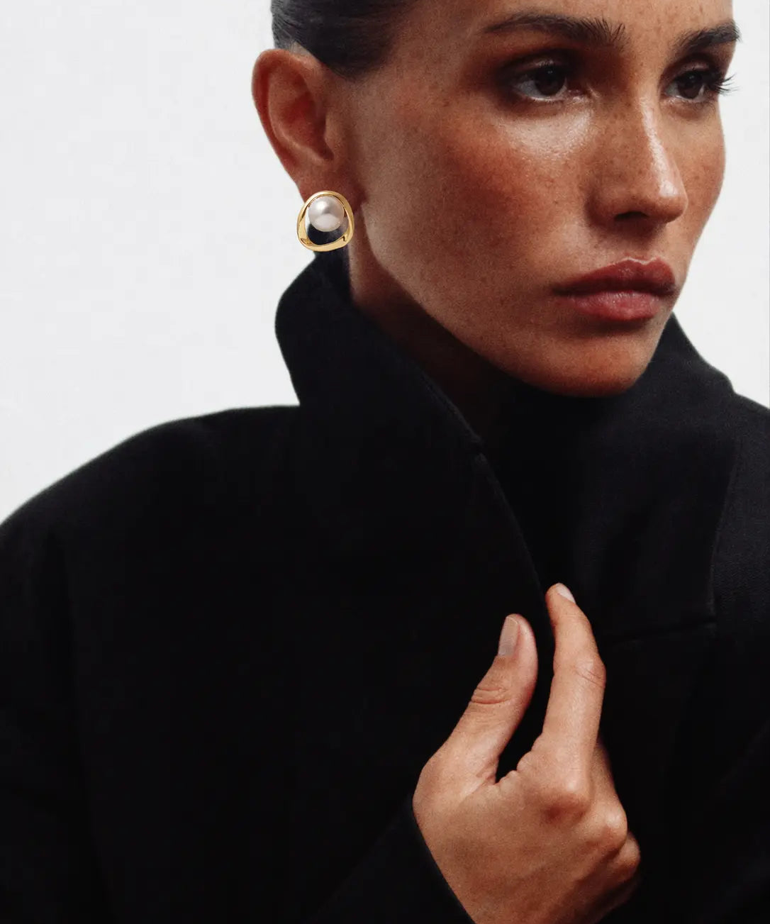 Golden Pearl Earrings shown in a lifestyle setting