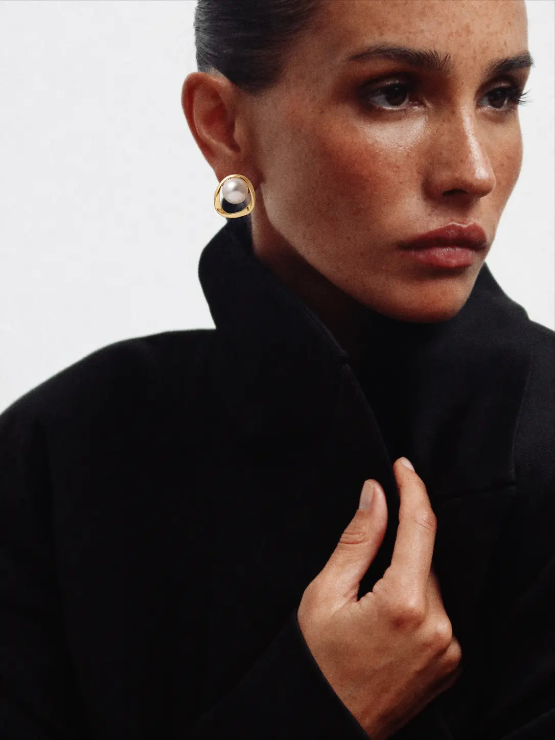 Golden Pearl Earrings shown in a lifestyle setting