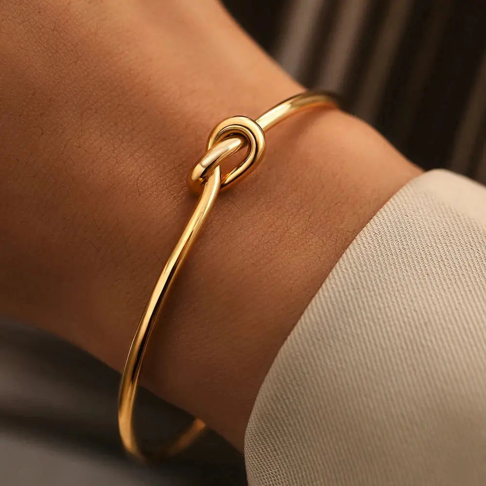 Golden Tie Bracelet shown in a lifestyle setting, alternate view