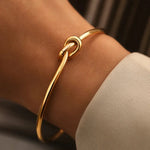 Golden Tie Bracelet shown in a lifestyle setting, alternate view
