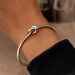 Golden Tie Bracelet shown in a lifestyle setting