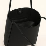 Open Leather button bag showing the interior, alternate view