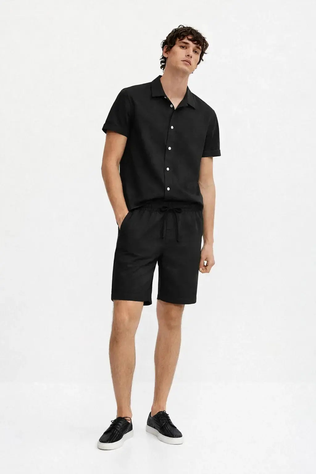 Linen Rayon Blend Button Up Shirt & Linen Drawstring Shorts shown in a lifestyle setting, cropped view