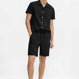 Linen Rayon Blend Button Up Shirt & Linen Drawstring Shorts shown in a lifestyle setting, cropped view