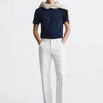 Lino Pants shown in a lifestyle setting, cropped view