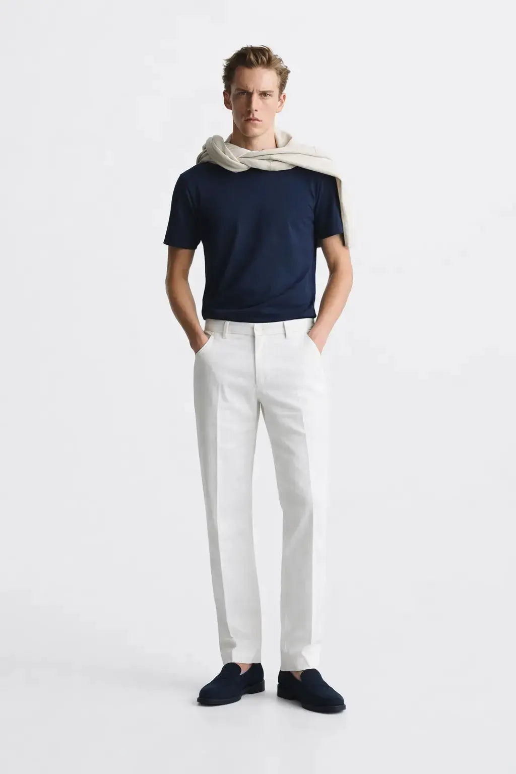 Lino Pants shown in a lifestyle setting, cropped view