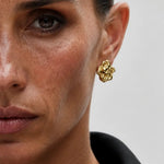 Luna Fern Earrings shown in a lifestyle setting, cropped view
