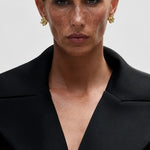 Luna Fern Earrings shown in a lifestyle setting, full length view